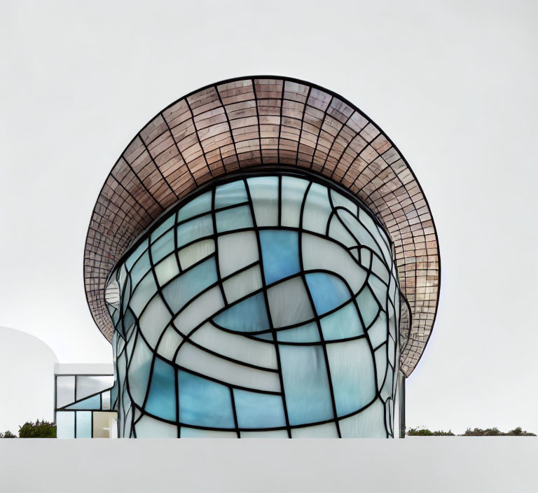 Glass façade and curved brown-tiled overhang on modern building under cloudy sky