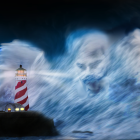 Towering Red and White Striped Lighthouse in Stormy Sea