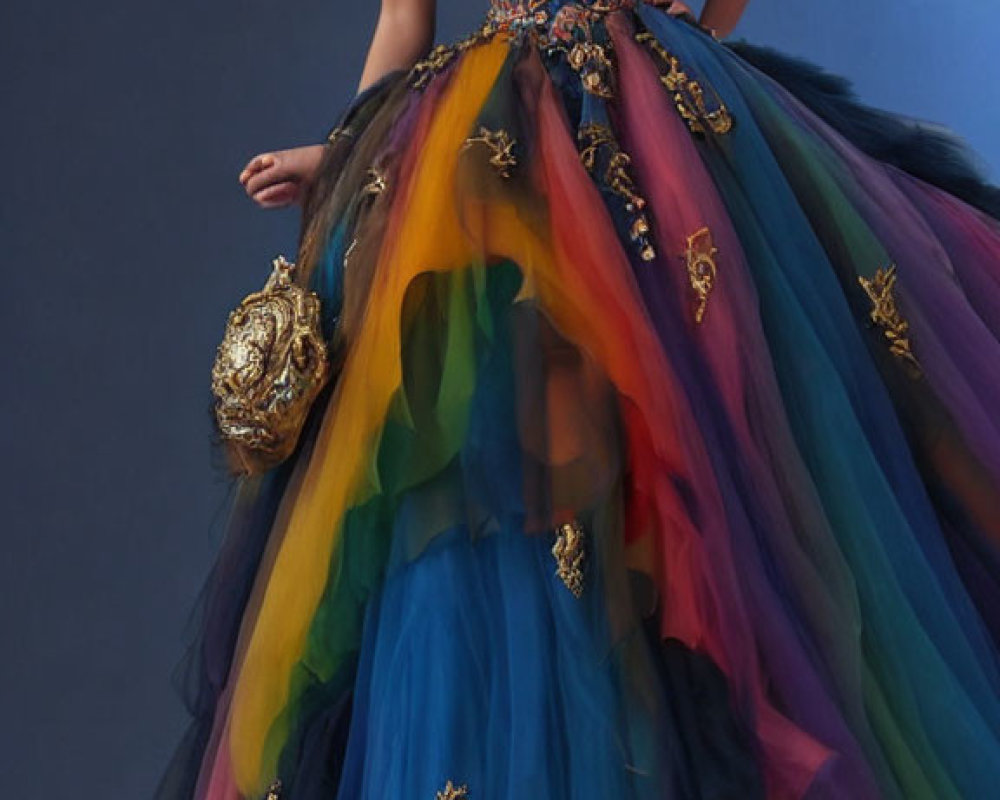 Elegant woman in strapless embroidered gown with multicolored tulle skirt