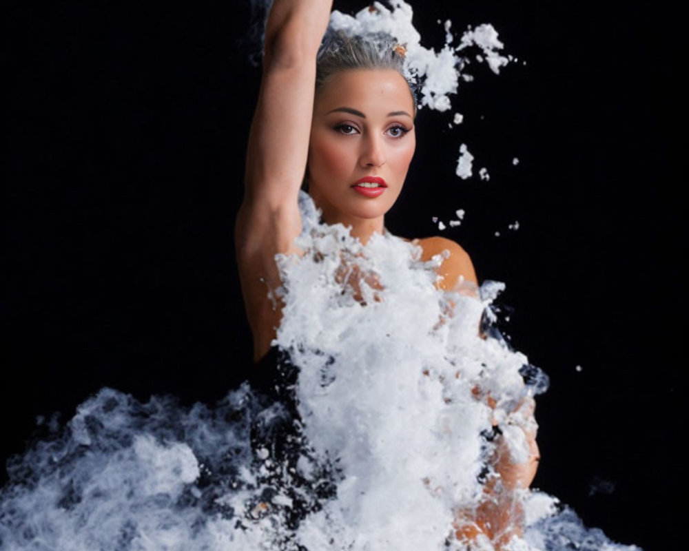 Dynamic pose of woman emerging from splashing water