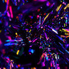 Colorful illuminated glitter balls on dark background: vibrant bokeh effect