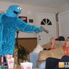 Blue Furry Creature with Large Eyes in Cozy Living Room Interaction