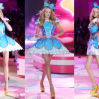 Three models in vibrant feathered mini dresses and high heels on a pink runway.