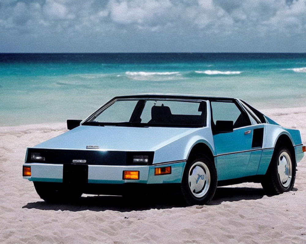 Vintage Blue and White Sports Car Parked on Sandy Beach