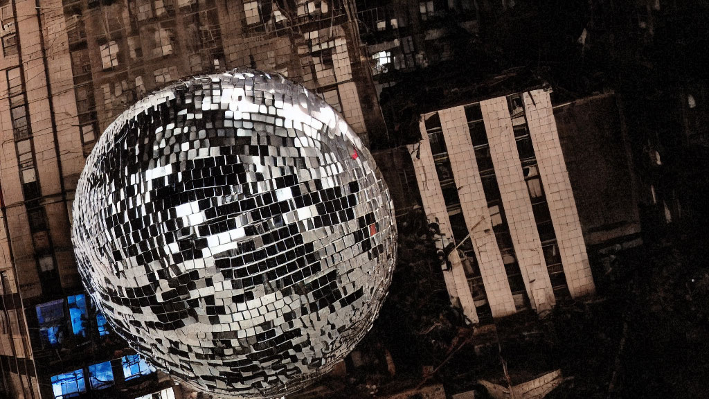 Urban landscape with large disco ball reflecting city lights