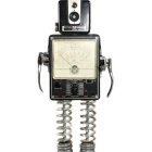 Vintage Woman Portrait Robot with Clear Legs and Black Headpiece