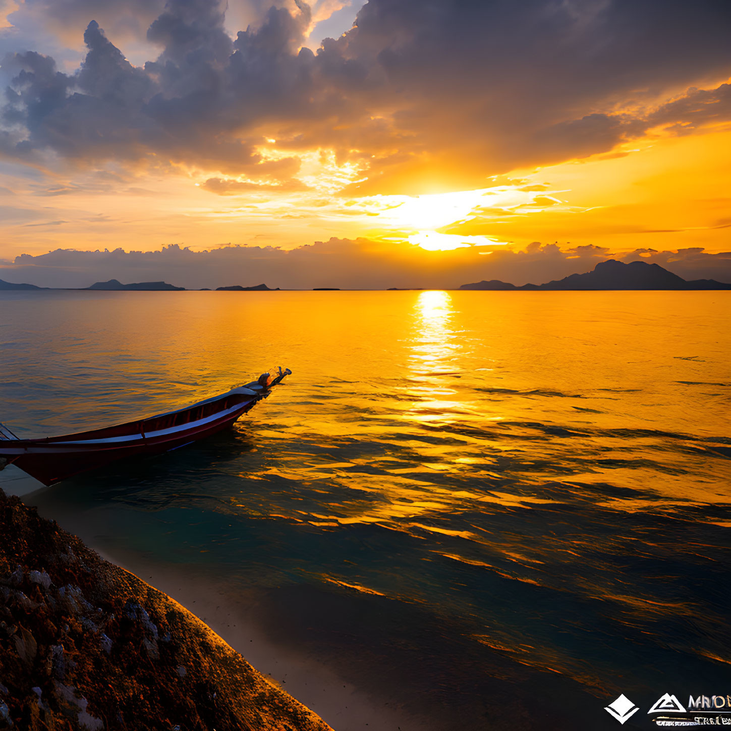 Boat floating on calm waters at sunset