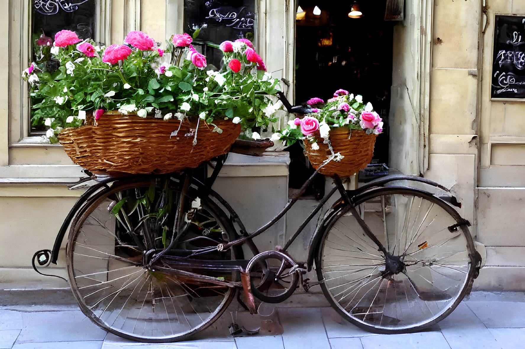 Vintage Bicycle with Wicker Baskets and Pink Flowers by Window Reflections