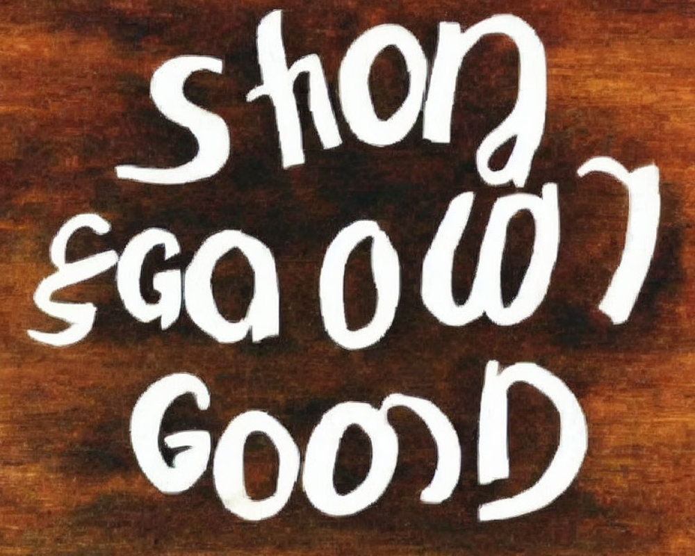 Ambigram design of "Short Good" in white text on wooden background