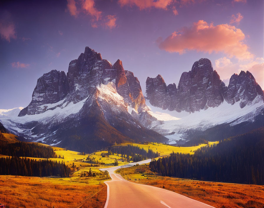 Scenic winding road to snow-capped mountains at golden hour