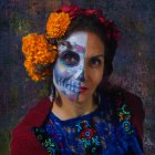 Vibrant Day of the Dead makeup with floral patterns