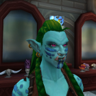 Green-skinned female character with forest-themed attire in mystical forest setting