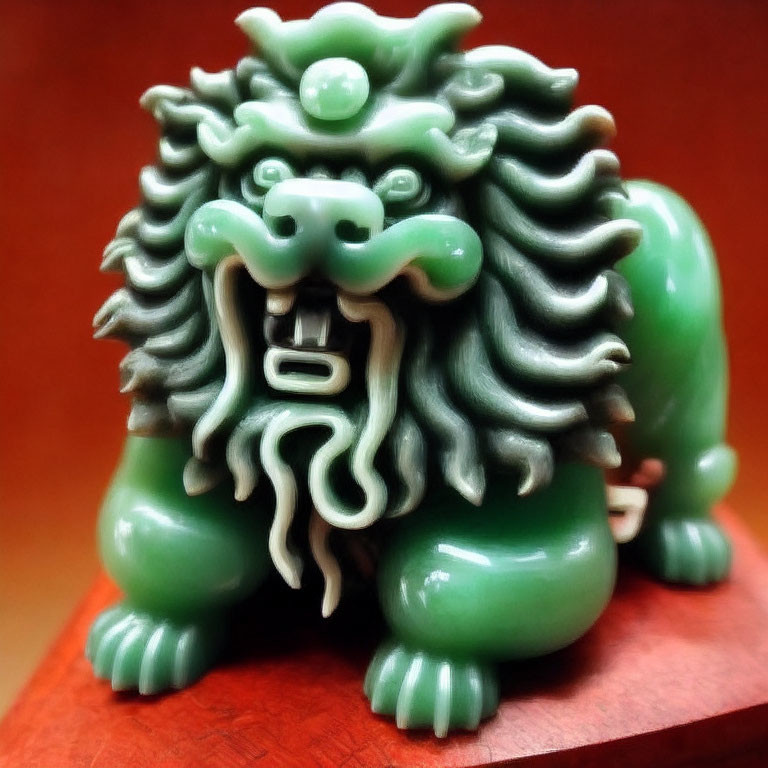 Mythical lion jade figurine with detailed mane on wooden base