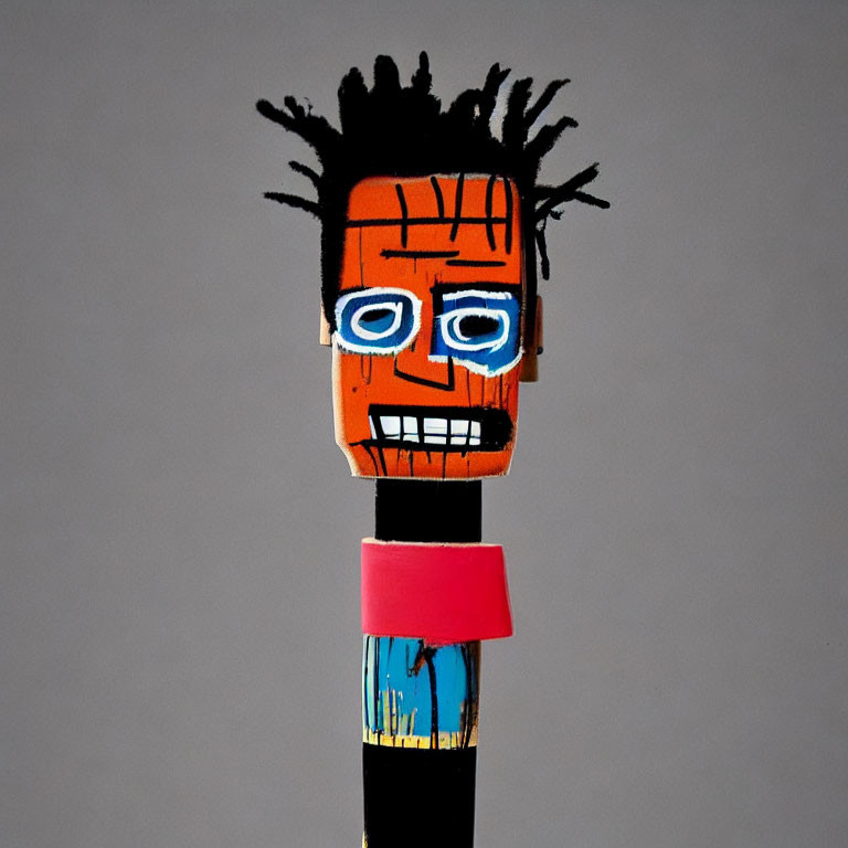 Colorful Wooden Figure with Black Spiky Hair and Blue Eyes
