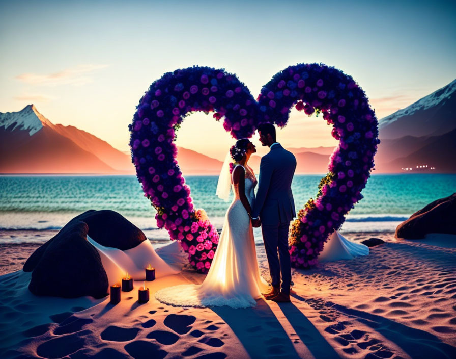 Romantic couple under heart-shaped floral arch on beach at sunset