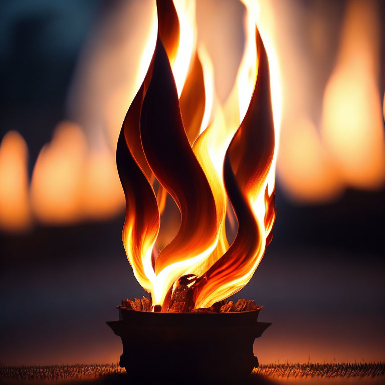Colorful flames flicker on small fire bowl in soft-focus dusk scene