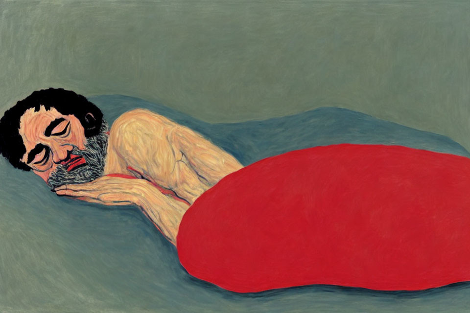 Bearded man lying on side with red blanket, grey background