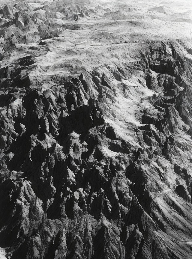 Monochrome aerial view of rugged mountain landscape