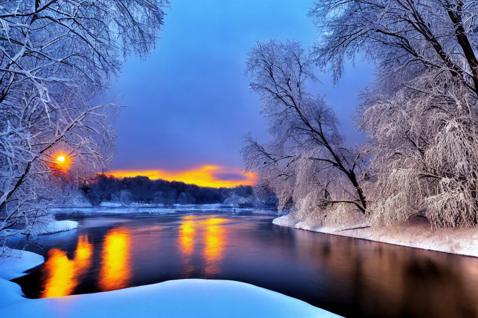 Snow-covered trees and river at sunset in serene winter landscape