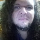 Monochrome portrait of intense long-haired man