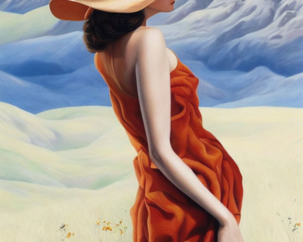 Woman in orange dress and wide-brimmed hat in field with mountains.
