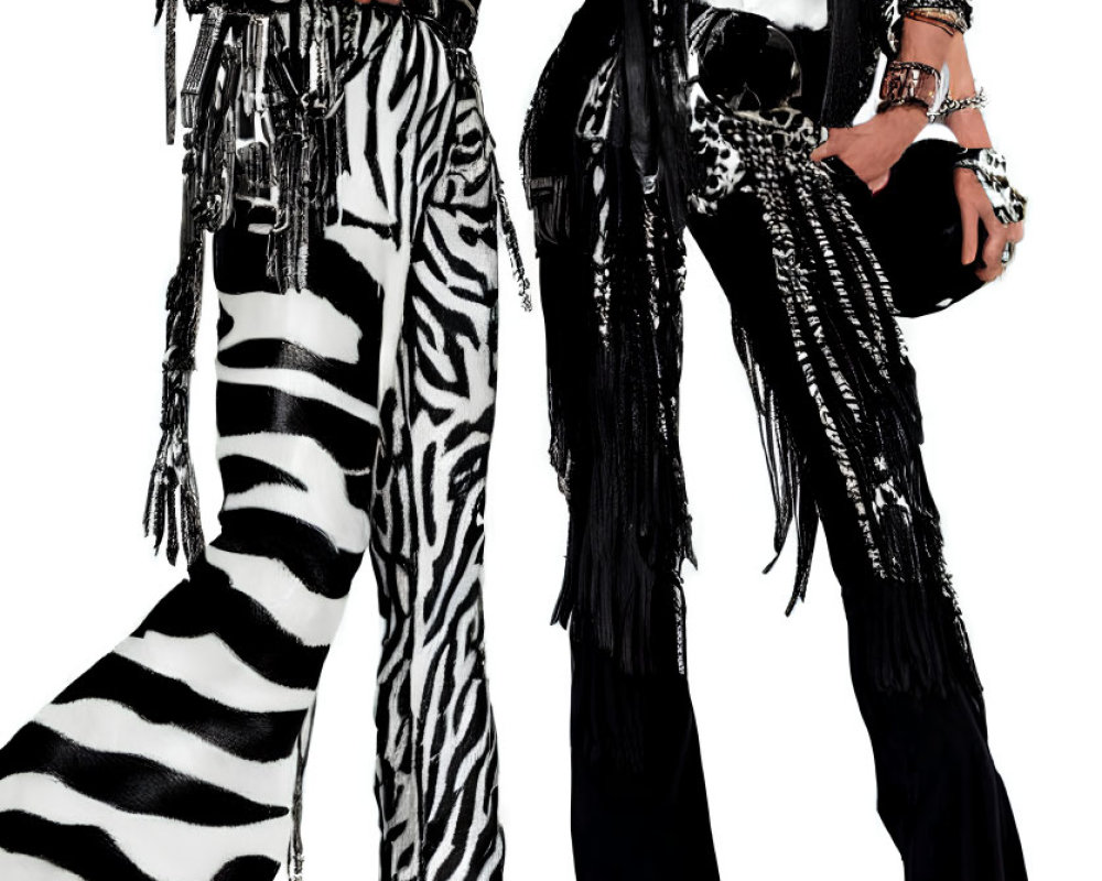 Fashionable duo in punk-rock style with zebra pants, leather jackets, and bold accessories.