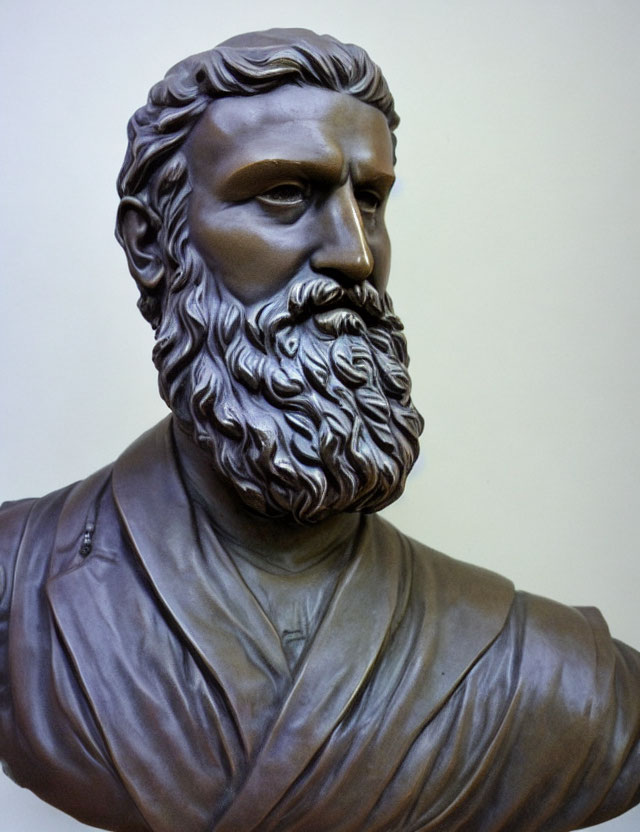 Classical style bust of bearded man with detailed hair on neutral background