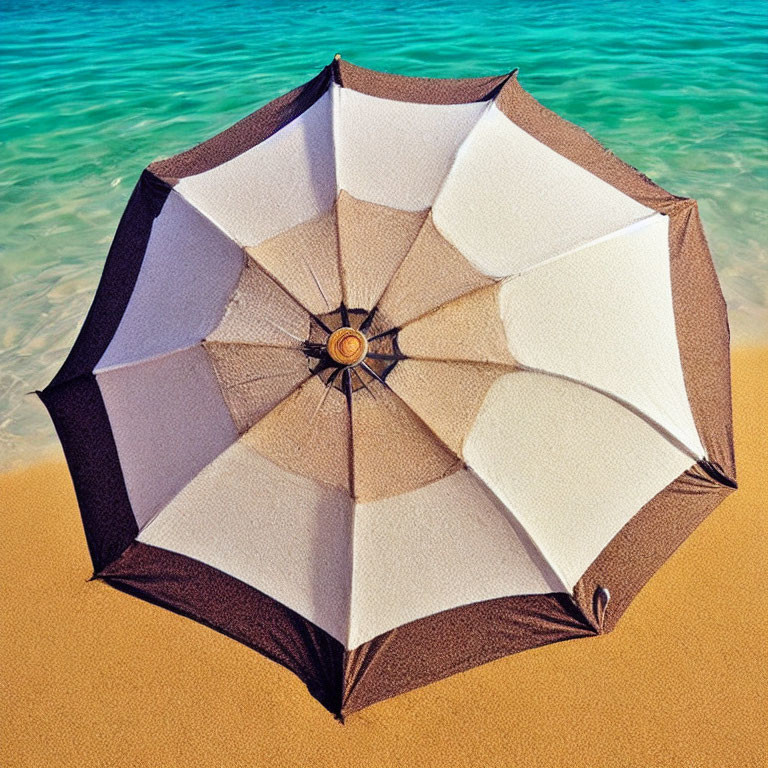 Vibrant umbrella on sandy beach with turquoise water