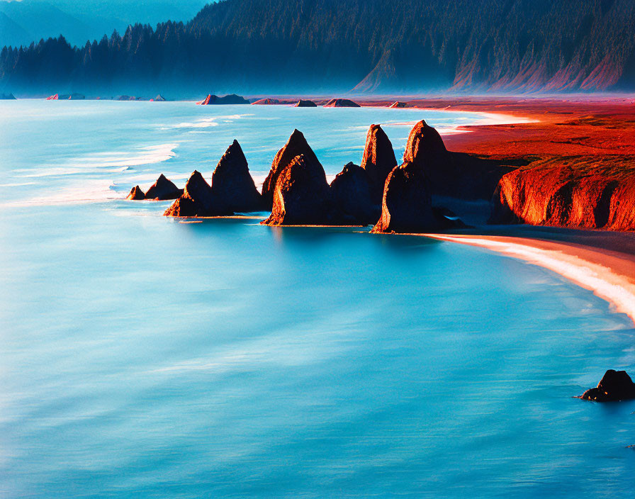 Rocky sea stacks and lush coastline under soft glowing light