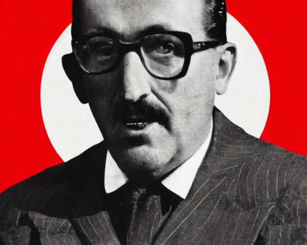 Monochrome image of man in glasses on red and white backdrop