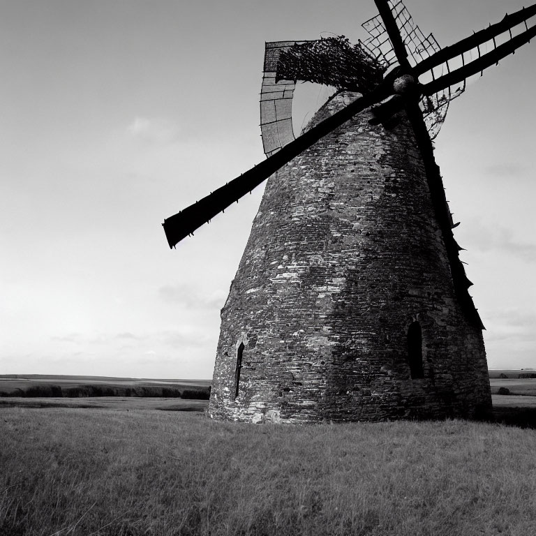 Monochrome picture of solitary windmill in open landscape