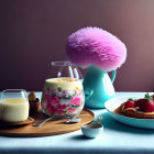 Vibrant breakfast spread with pancakes, milkshake, juice, and fruits on wooden tray
