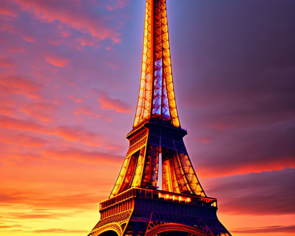 Iconic Eiffel Tower at twilight with vibrant orange and blue sky