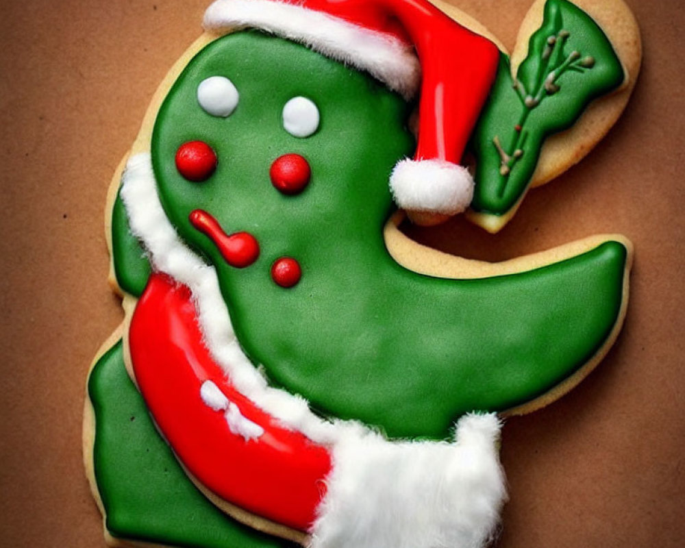 Festive Green Dinosaur Cookie with Santa Hat and Icing Details