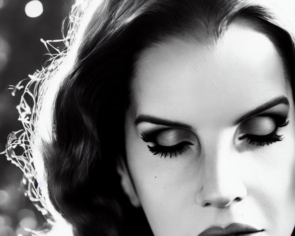 Monochrome close-up of woman with vintage waves and glamorous makeup