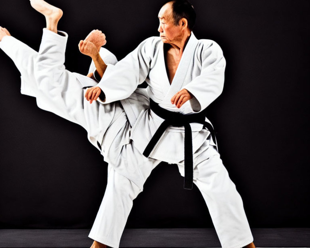 Martial artist in white gi and black belt executing high side kick