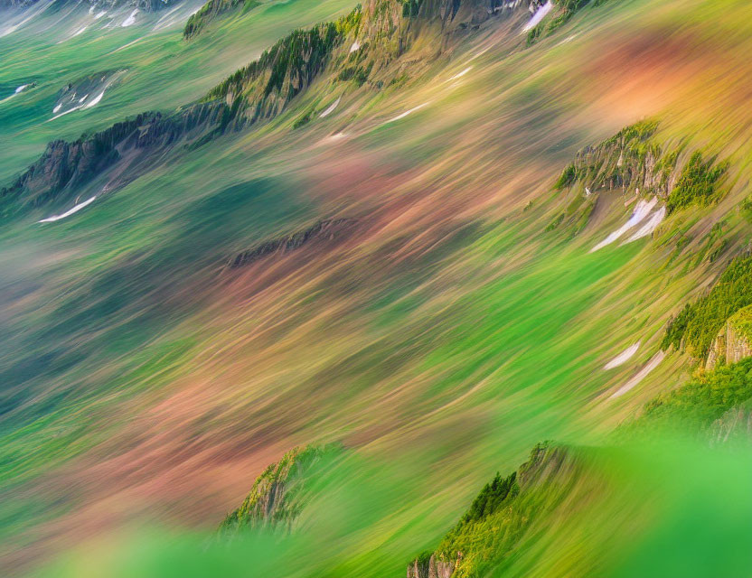 Blurred abstract landscape with vibrant green, brown, and red streaks
