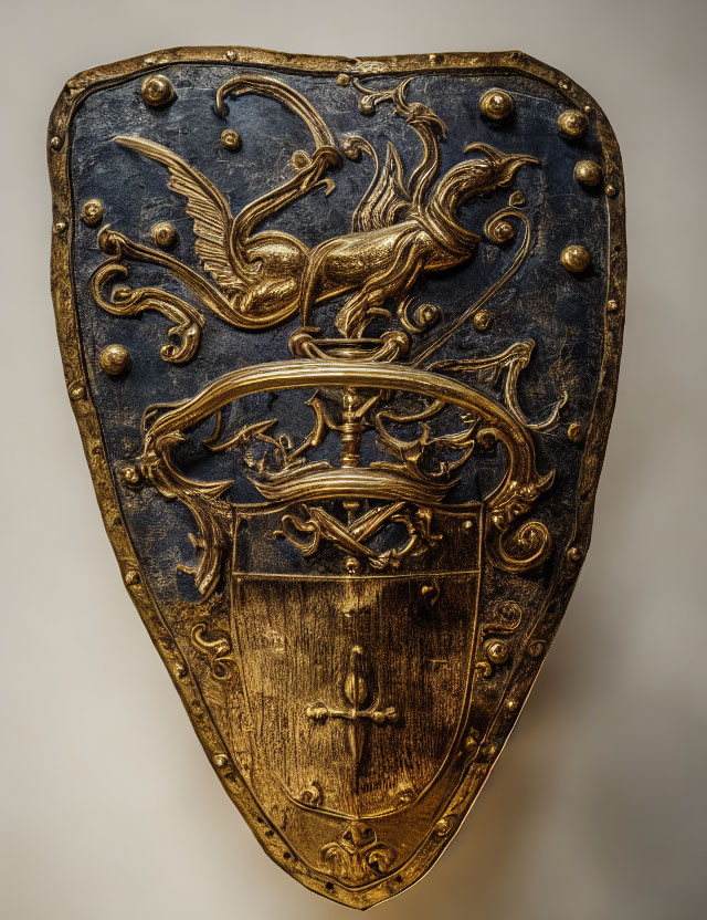 Medieval shield with golden phoenix design on blue background