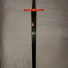 Golden hilt sword with circular emblem and star design on blade