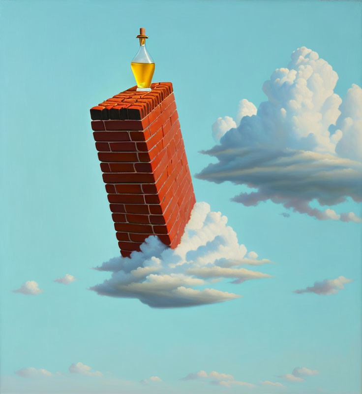 Golden trophy on narrow brick chimney against blue sky