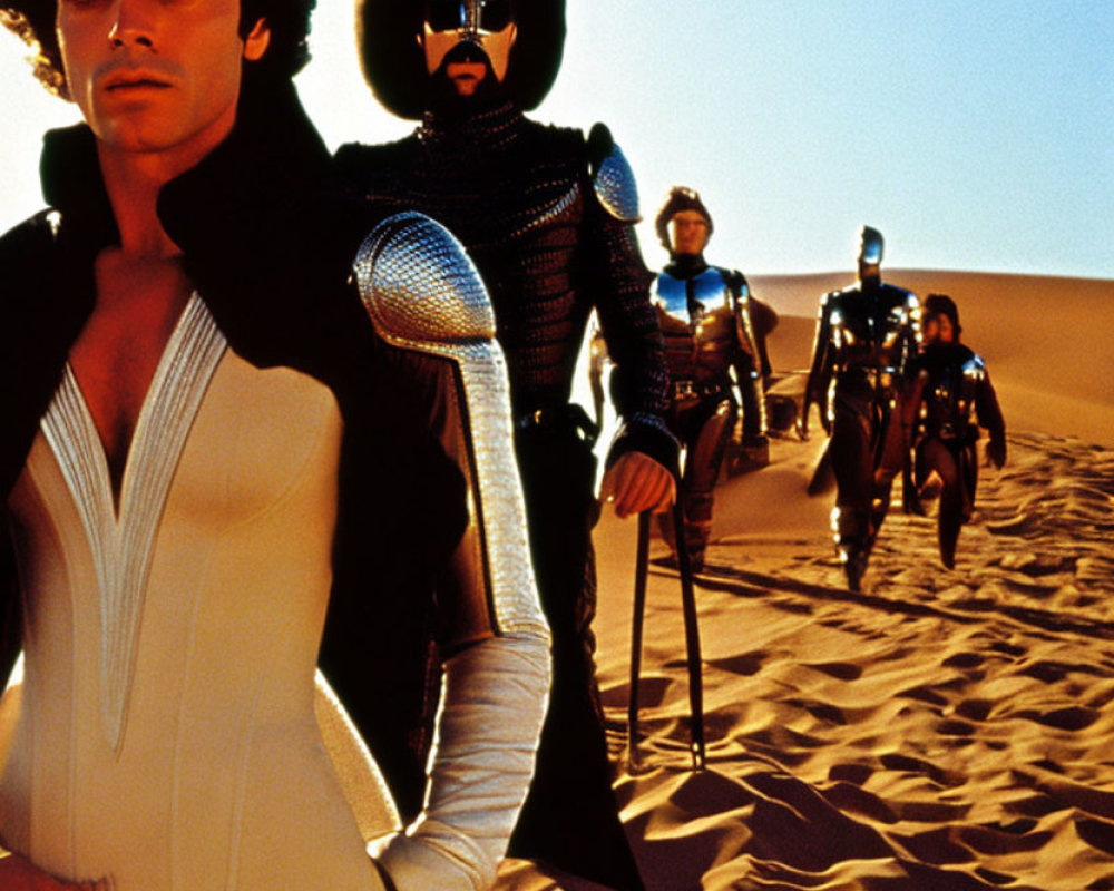 Futuristic characters in unique costumes on desert dune under bright sky