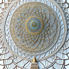 Golden Mandala with Geometric Design on Blue Background in White Ornate Structure