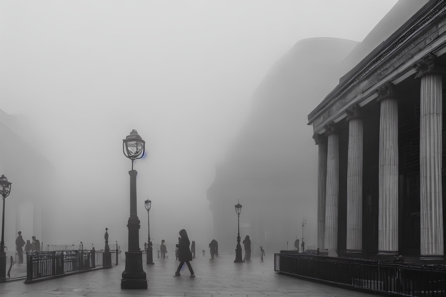 Misty urban scene with vintage street lamps and classic architecture in fog