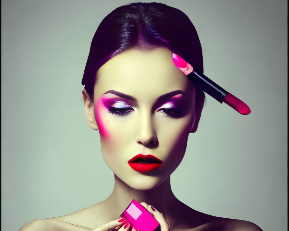 Vibrant makeup portrait of woman with pink eyeshadow and red lipstick