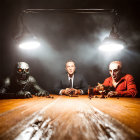 Group of Five Playing Chess Under Dramatic Lighting