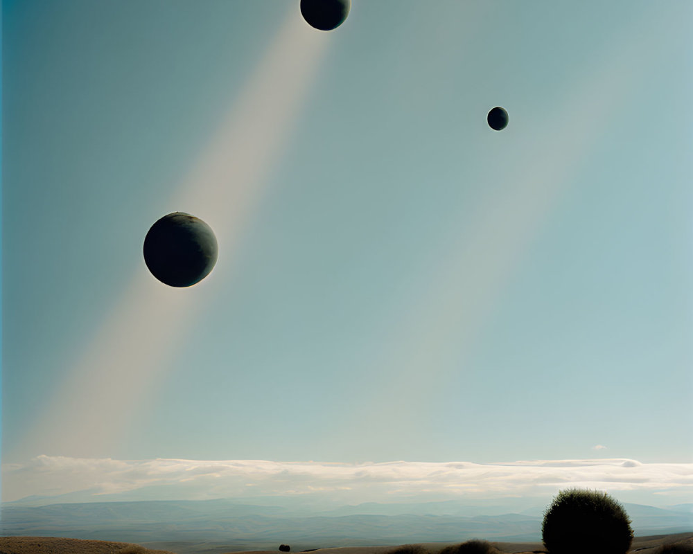 Surreal landscape with dark spheres in clear sky above rolling hills