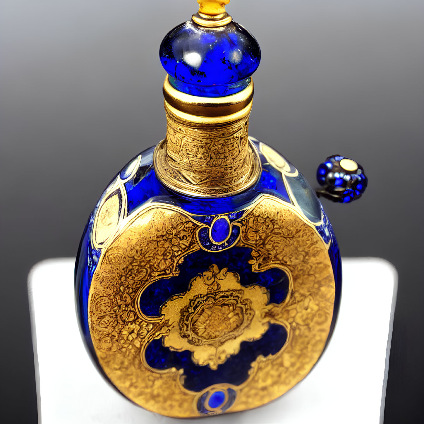 Luxurious Round Glass Perfume Bottle with Gold and Blue Details