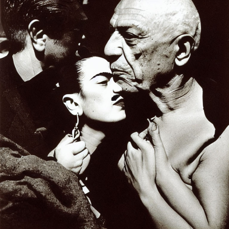 Monochrome image of woman kissed by bald man with another man in background