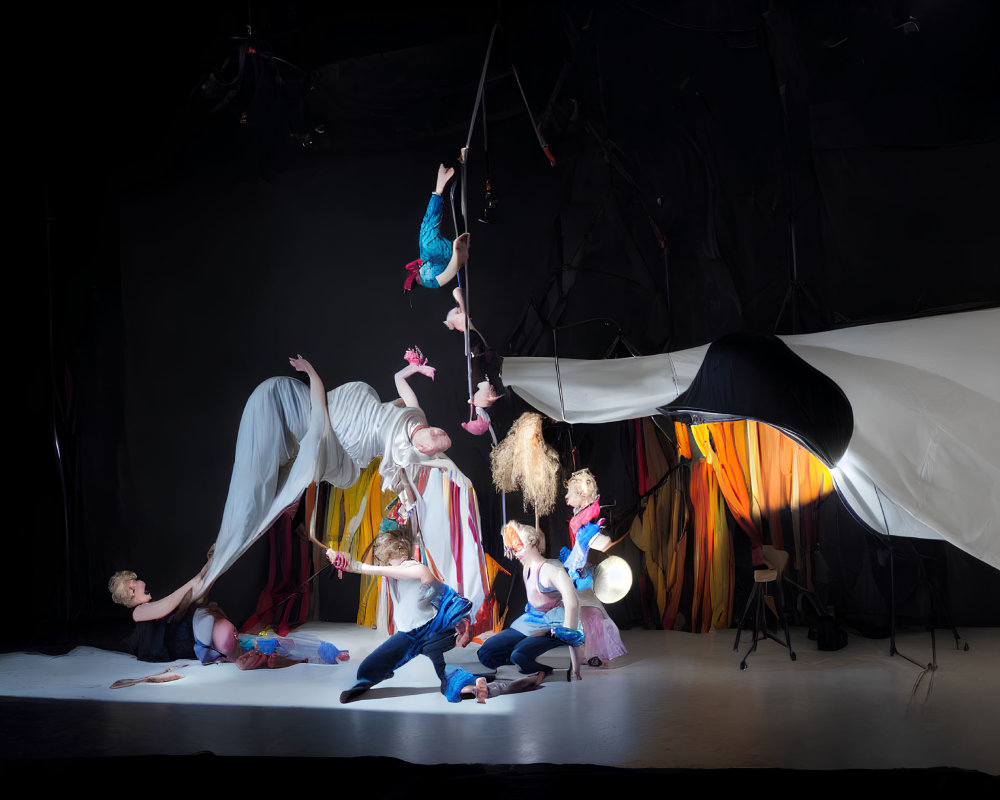 Avant-garde theater production: Colorful costumes, dynamic poses, and flowing fabrics
