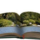 Open book revealing 3D landscape of hills, house, trees, and sea